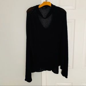 Black sweater with flared sleeves